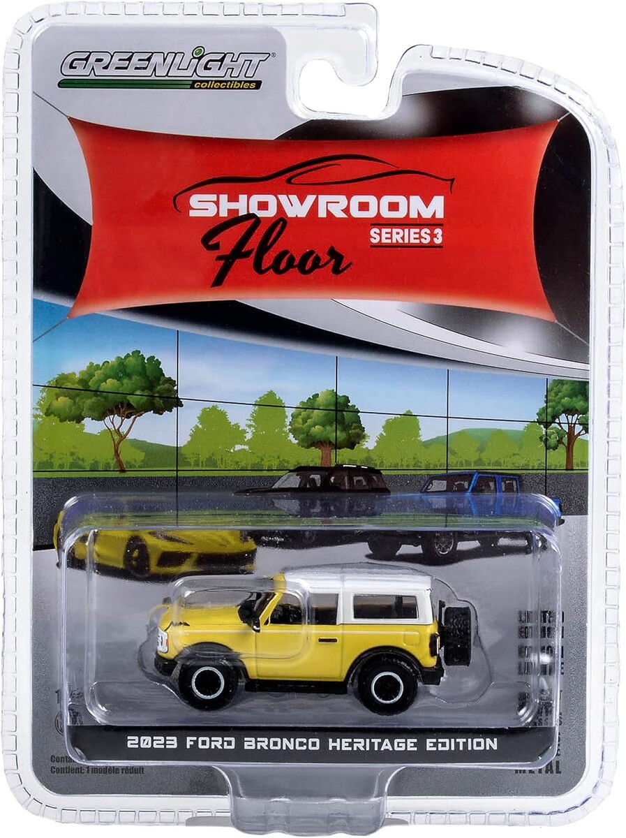 Greenlight 1/64 Showroom Floor Series 3- 2023 Bronco 2-Door Heritage Edition - Yellowstone Metallic con techo blanco Oxford 68030-D - Thumbnail